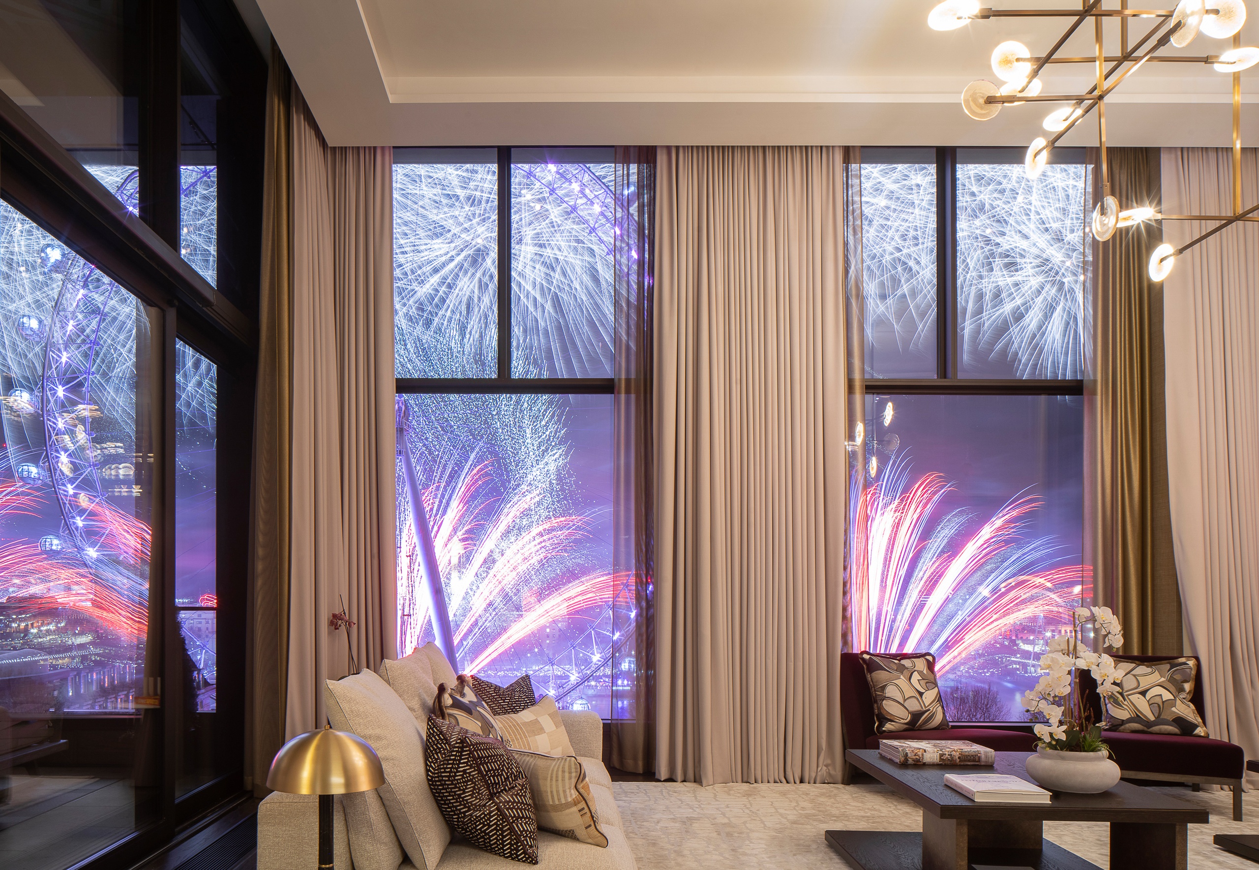 View of London Eye's fireworks from Southbank Place apartment living room