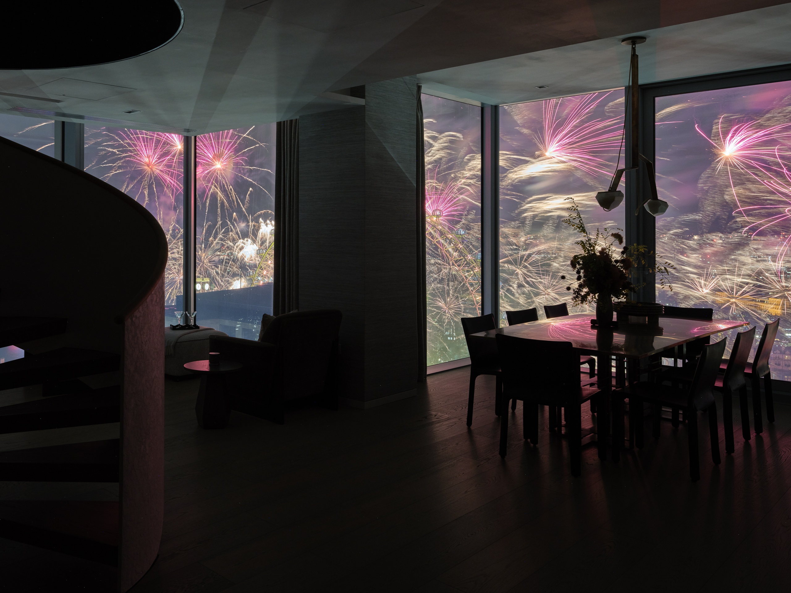 View of London Eye's fireworks from Southbank Place apartment dining room