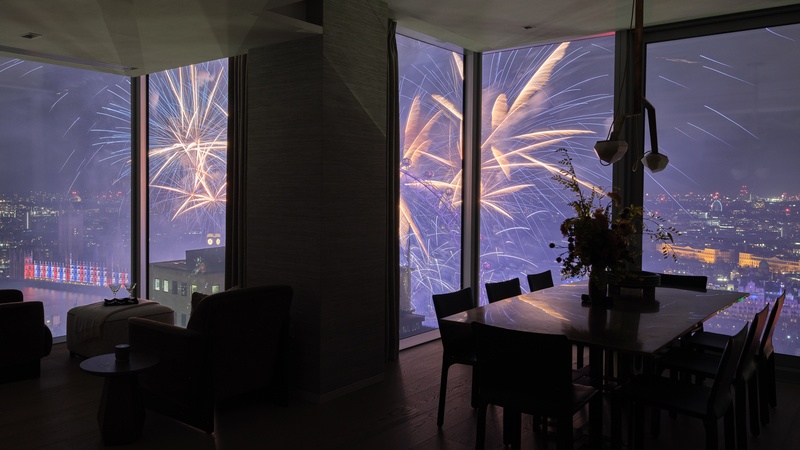 View of London Eye's fireworks from Southbank Place apartment dining room