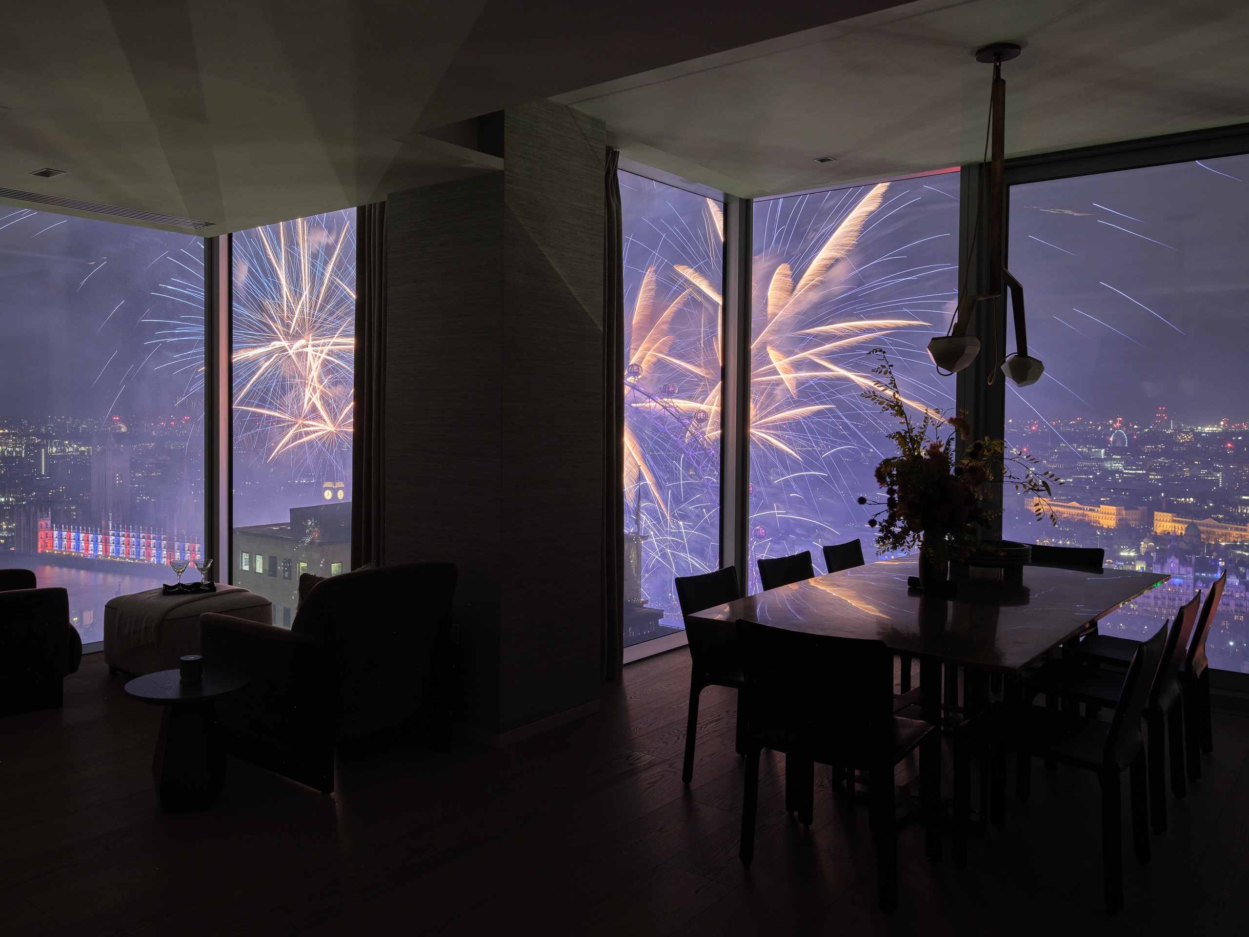 View of London Eye's fireworks from Southbank Place apartment dining room