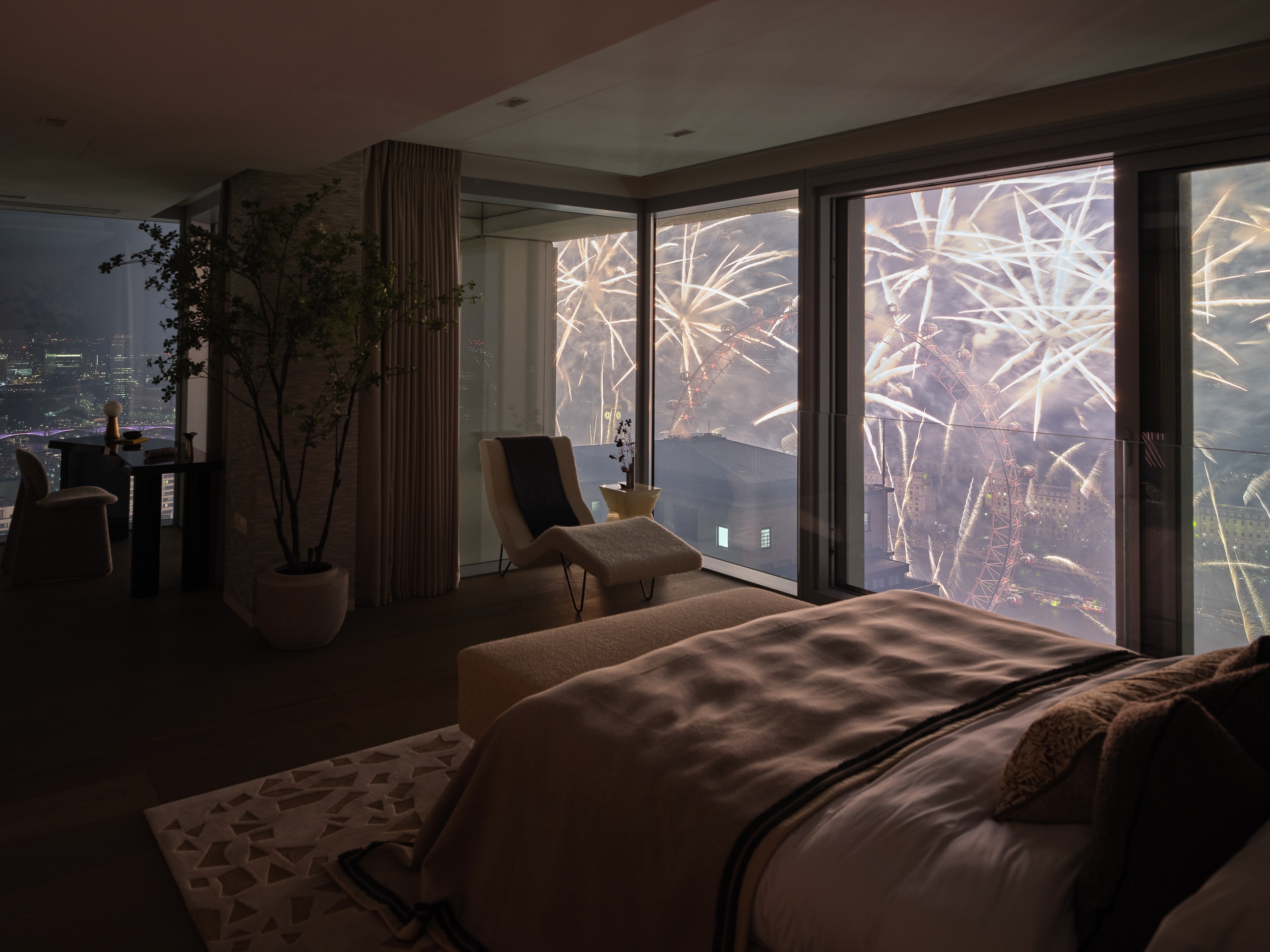 View of London Eye's fireworks from Southbank Place apartment bedroom